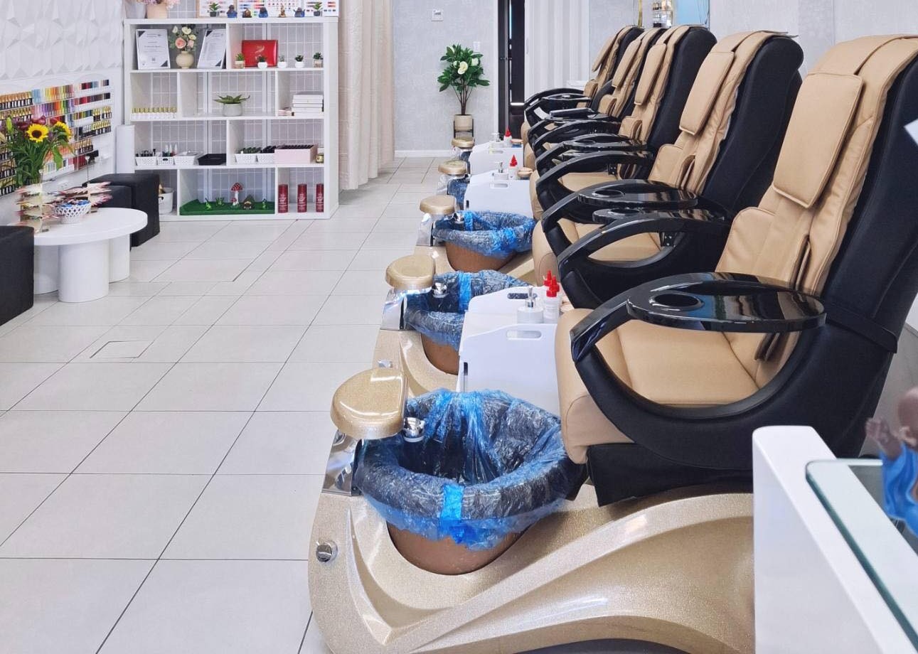 The salon floor, with the polish rack and pedicure chairs